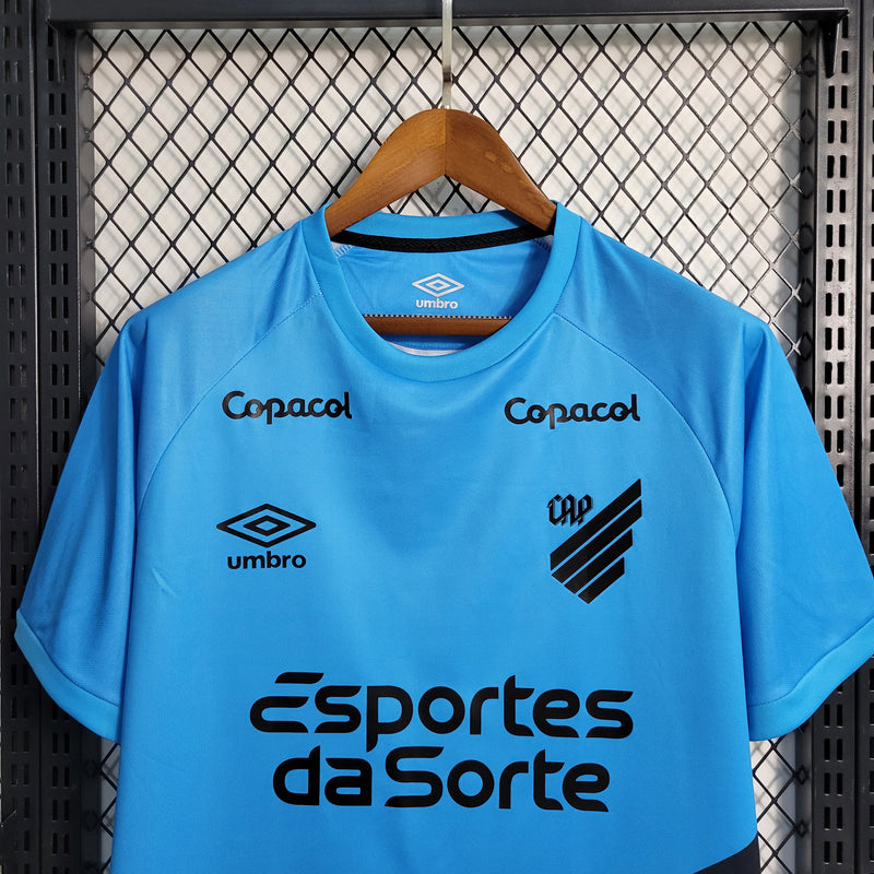 camisa-athletico paranaense-away-ii-2-azul claro-esportes da sorte-umbro-23-24-neymar-messi-cr7-futebol 