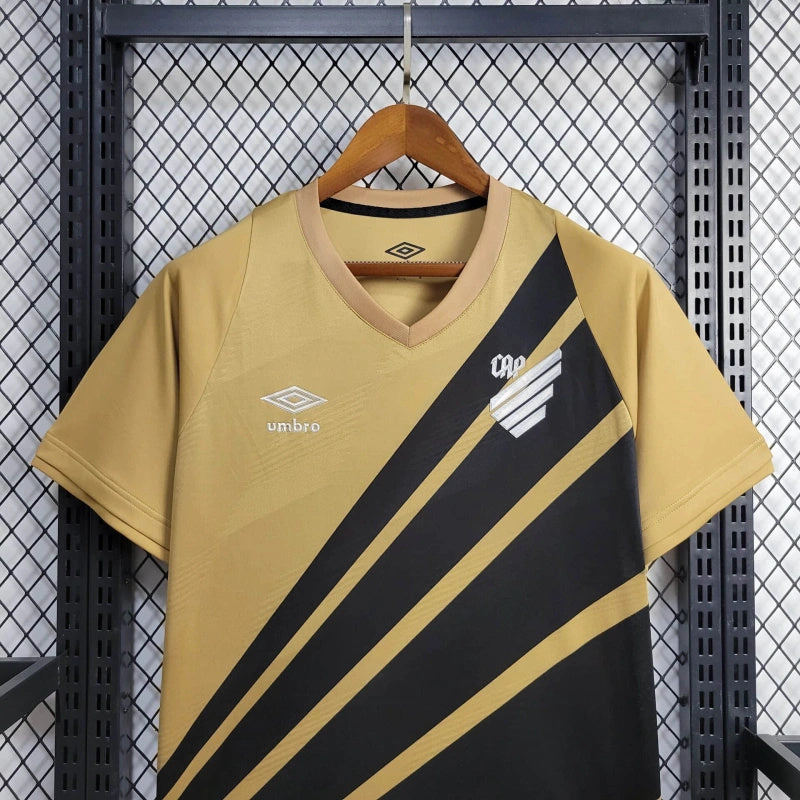 camisa-athletico paranaense-away-ii-2-dourada-umbro-24-25-neymar-messi-cr7-futebol 