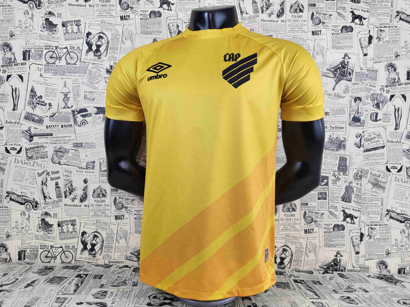 camisa-athletico paranaense-goleiro-amarela-umbro-23-24-neymar-messi-cr7-futebol