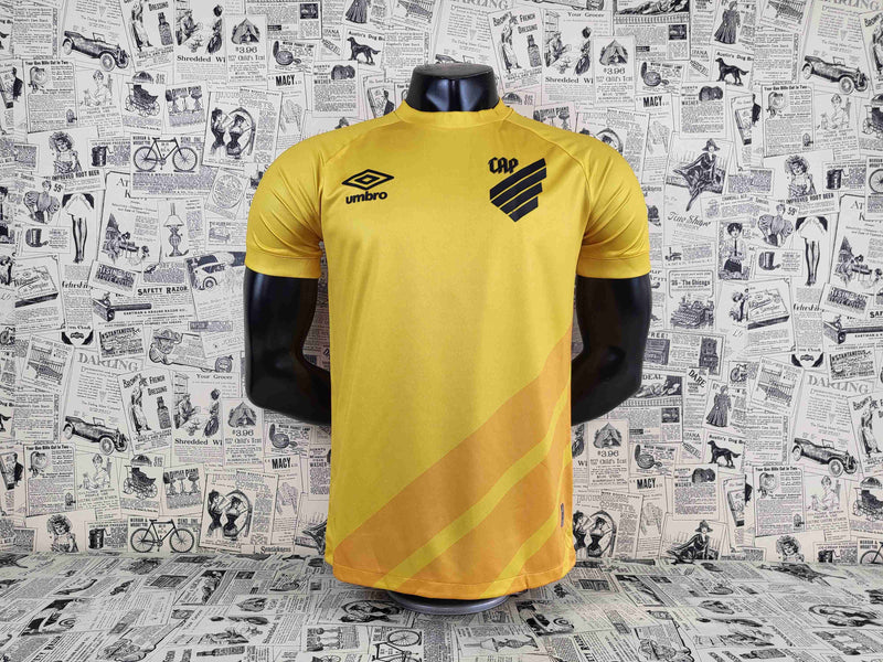 camisa-athletico paranaense-goleiro-amarela-umbro-23-24-neymar-messi-cr7-futebol