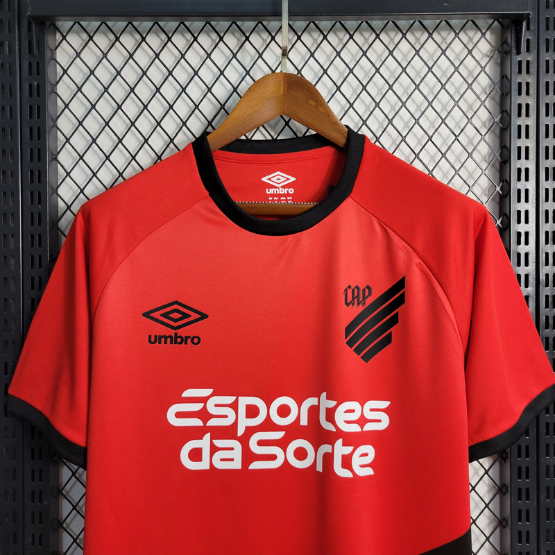 camisa-athletico paranaense-home-i-1-vermelha-esportes da sorte-umbro-23-24-neymar-messi-cr7-futebol 