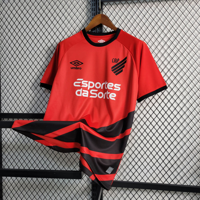camisa-athletico paranaense-home-i-1-vermelha-esportes da sorte-umbro-23-24-neymar-messi-cr7-futebol 