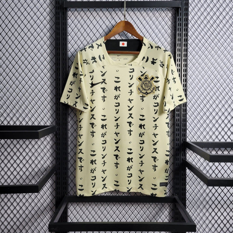 camisa-corinthians-japão-iii-3-creme-nike-22-23-neymar-messi-cr7-futebol 