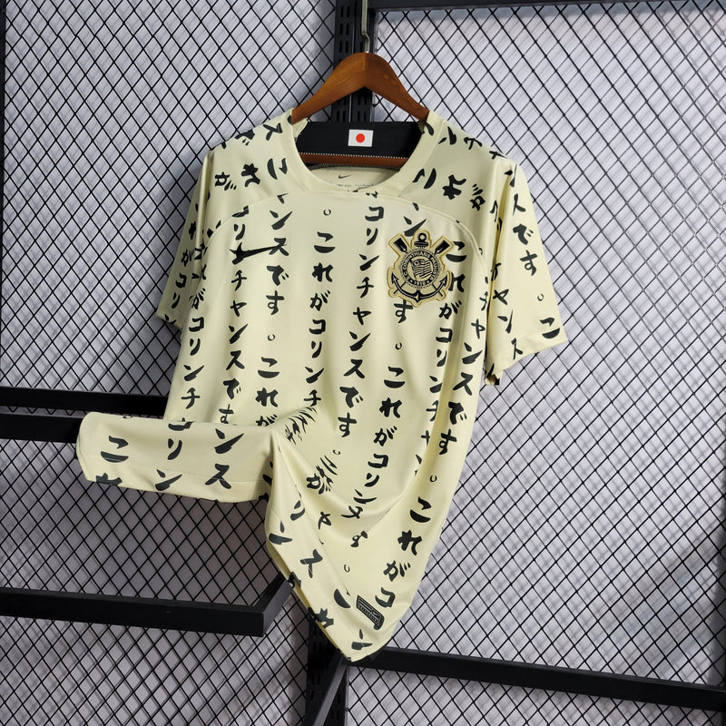 camisa-corinthians-japão-iii-3-creme-nike-22-23-neymar-messi-cr7-futebol 