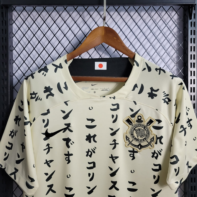camisa-corinthians-japão-iii-3-creme-nike-22-23-neymar-messi-cr7-futebol 